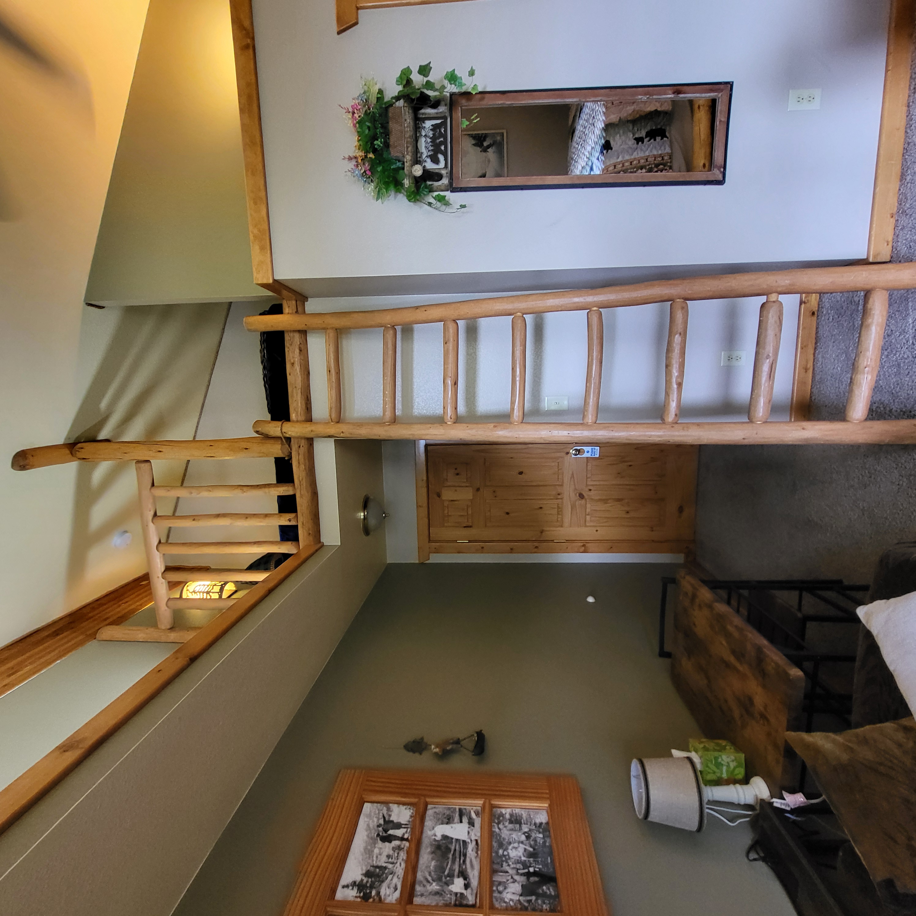 Mt. Columbia Room going up the laddered loft to access the Twin Bed