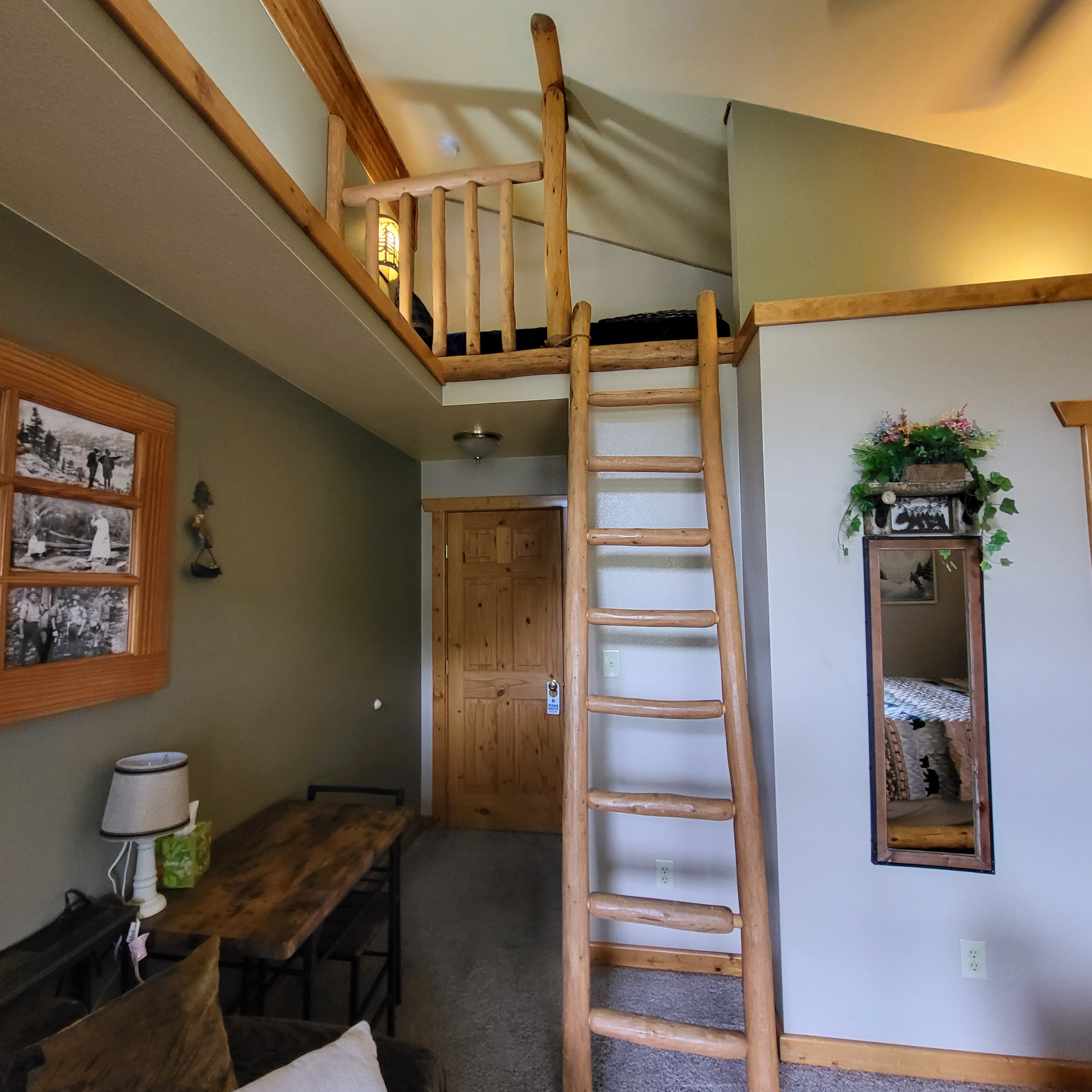 Mt. Columbia Room going up the laddered loft to access the Twin Bed