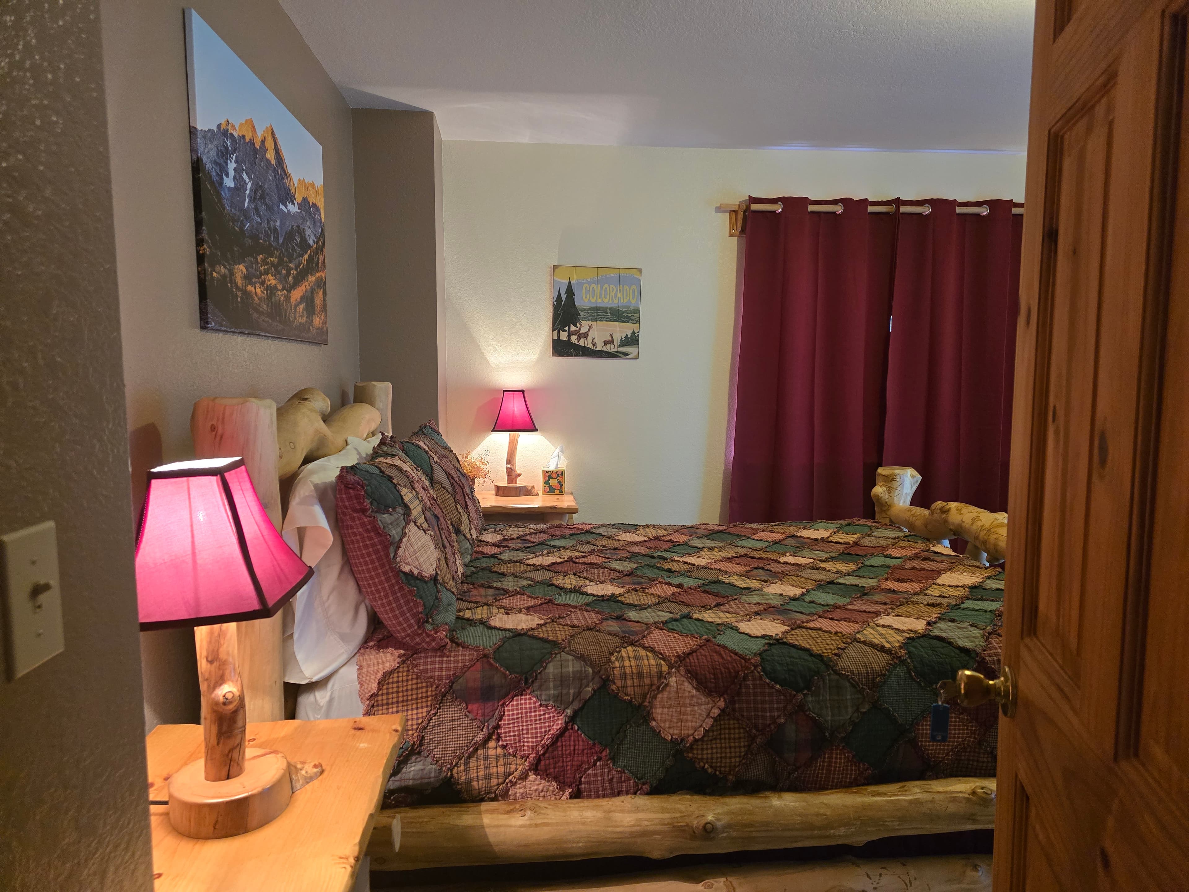 Mt. Harvard Room Entry showing night stand, Log Bed as you enter the room.
